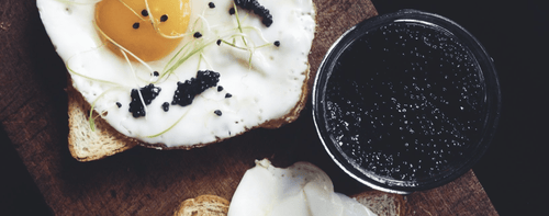 FRIED EGGS WITH JAMÓN
AND CAVIAR - Caviar Dynasty